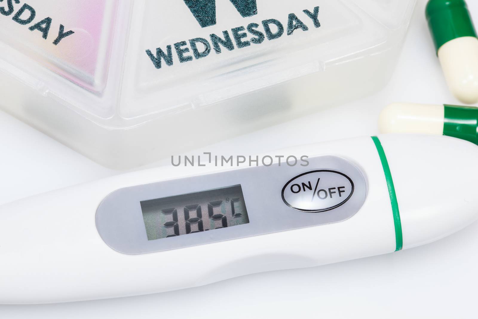 Digital thermometer showing 38.5 temperature.
( 101.3°F) Since fever protects the body from injury or infection, doctors generally only treat fevers above 102.2°F (39°C) in children, and above 101.3°F (38.5°C) in adults.Fever should not necessarily be treated. Fever is an important signal that there's something wrong in the body, and it can be used to govern medical treatment and gauge its effectiveness







Thermometer and pills closeup