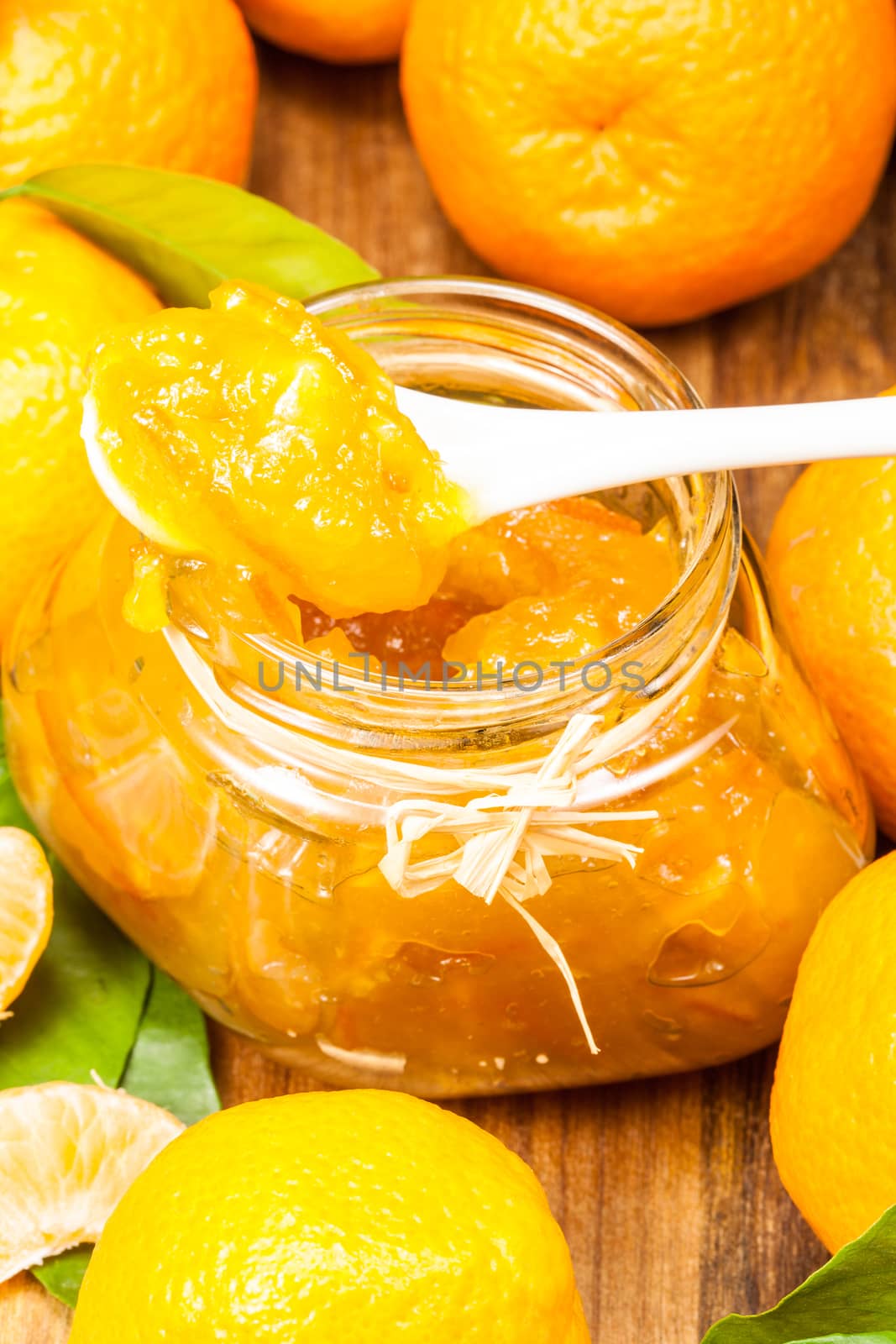 orange mandarin homemade jam in a glass jar