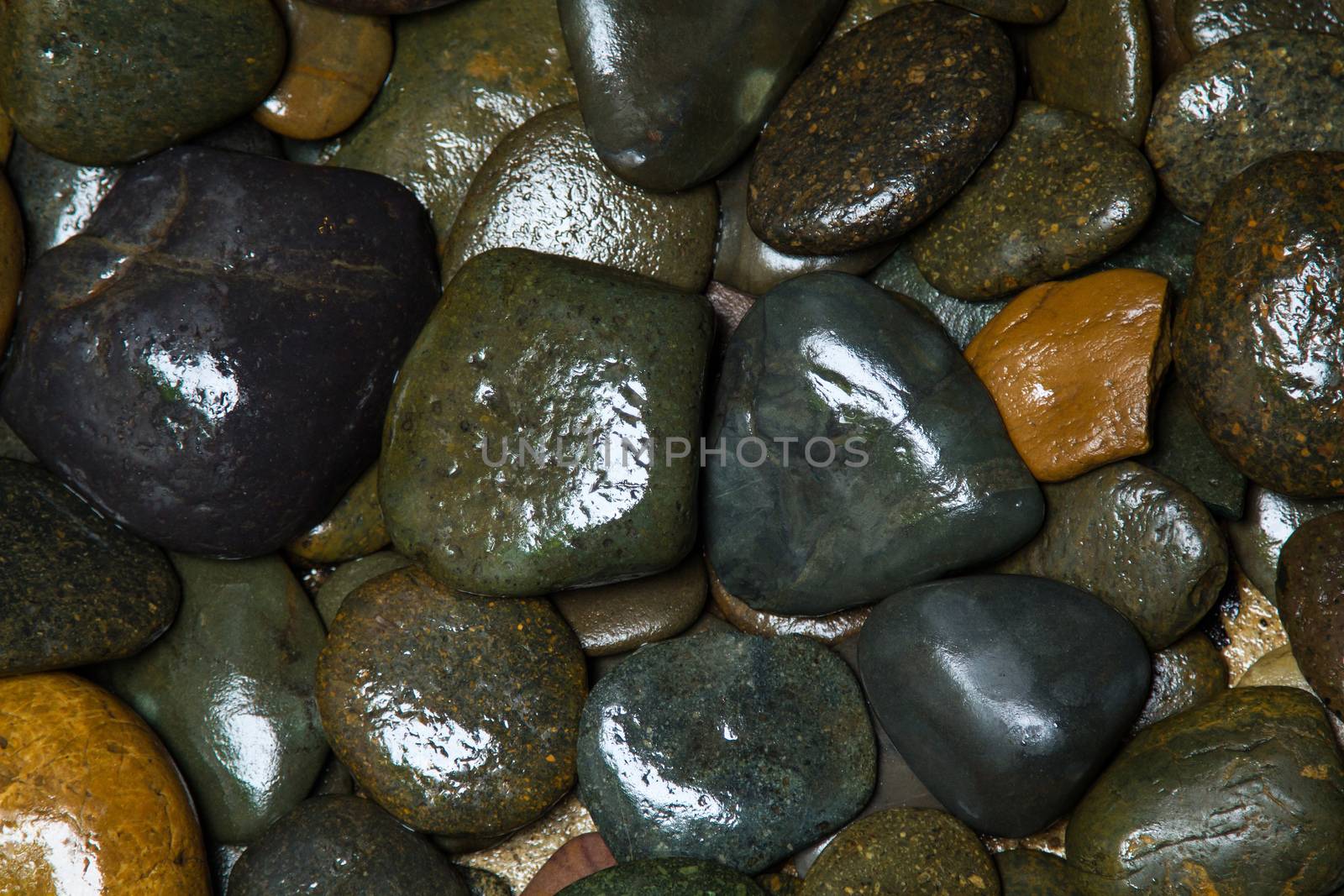 Pile of round peeble stones for background