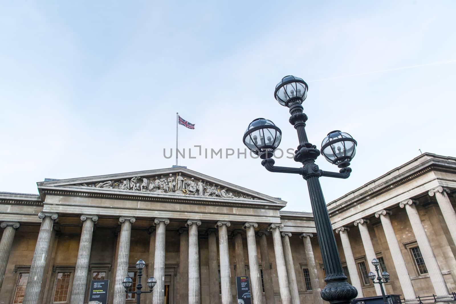 LONDON, UK - JANUARY 17: Lamp post with entrance to the British Museum in the background. January 17, 2015 in London.