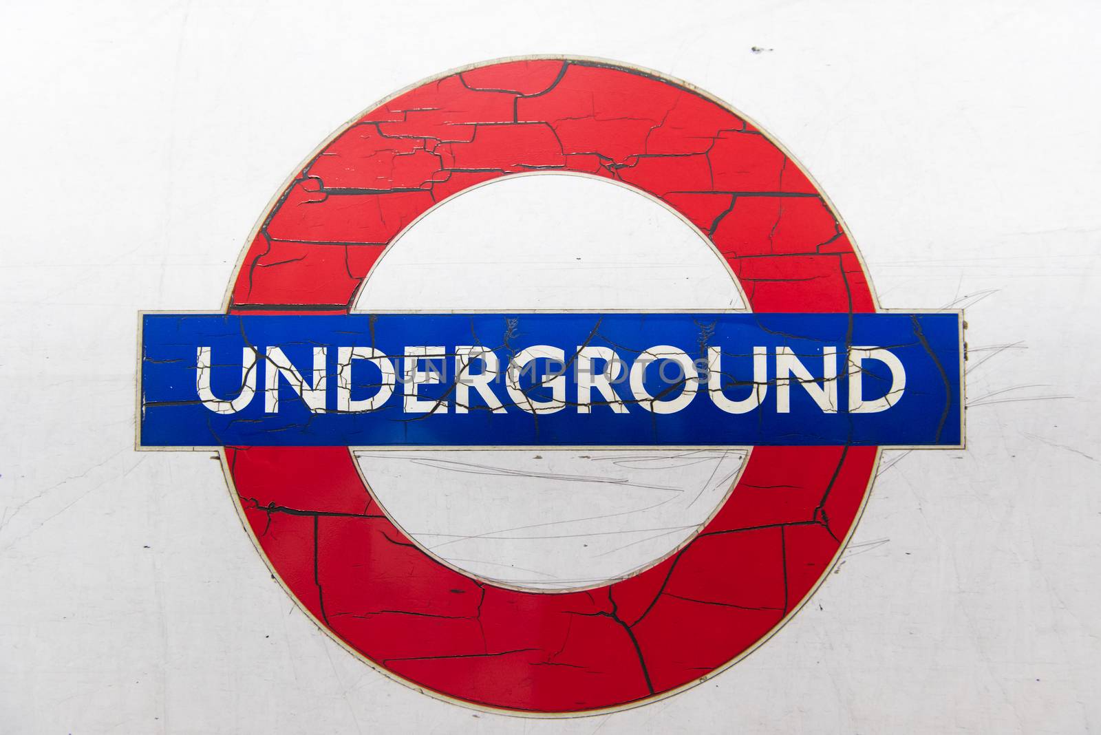 LONDON, UK - London JANUARY 31: Details of run down logo of the London Underground, with paint cracking and peeling off. January 31, 2015 in London.