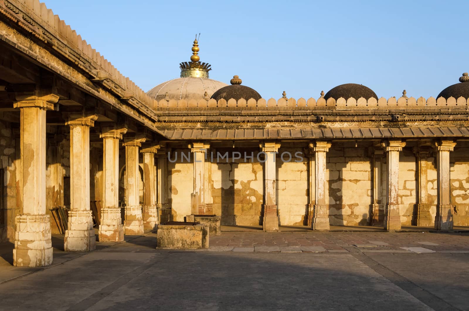 Colonnaded of historic Tomb of Mehmud Begada, Sultan of Gujarat at Sarkhej Roza mosque in Ahmedabad, India