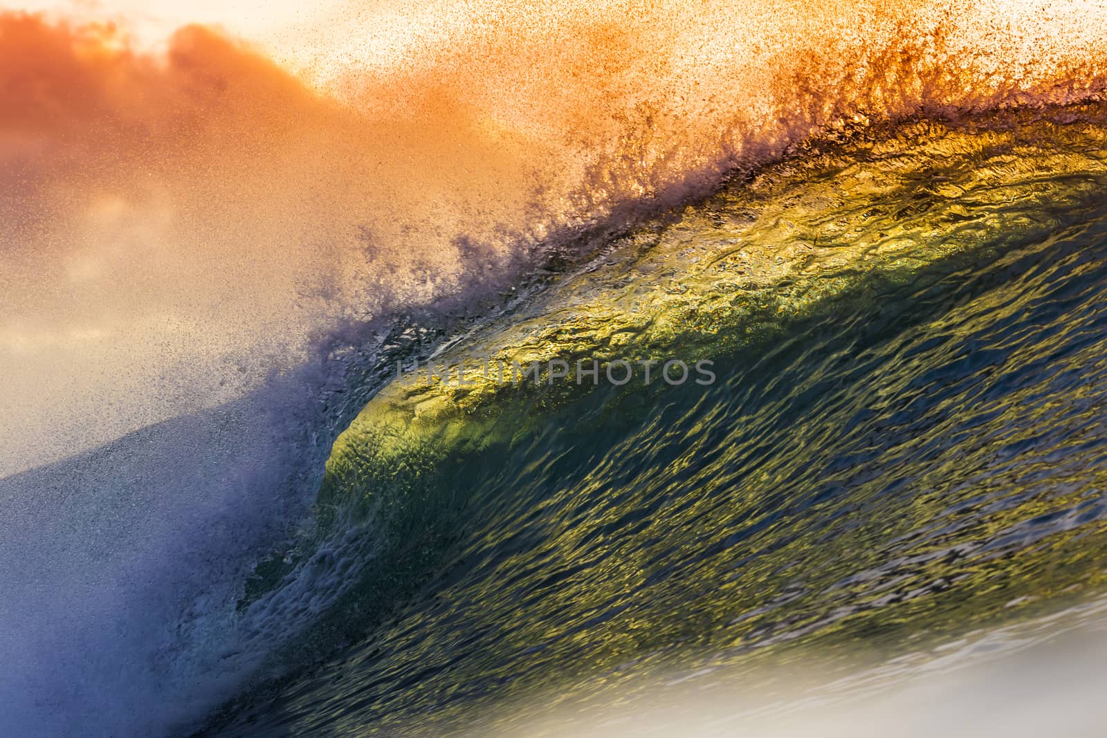 Colored Ocean Wave Falling Down at Sunset Time.