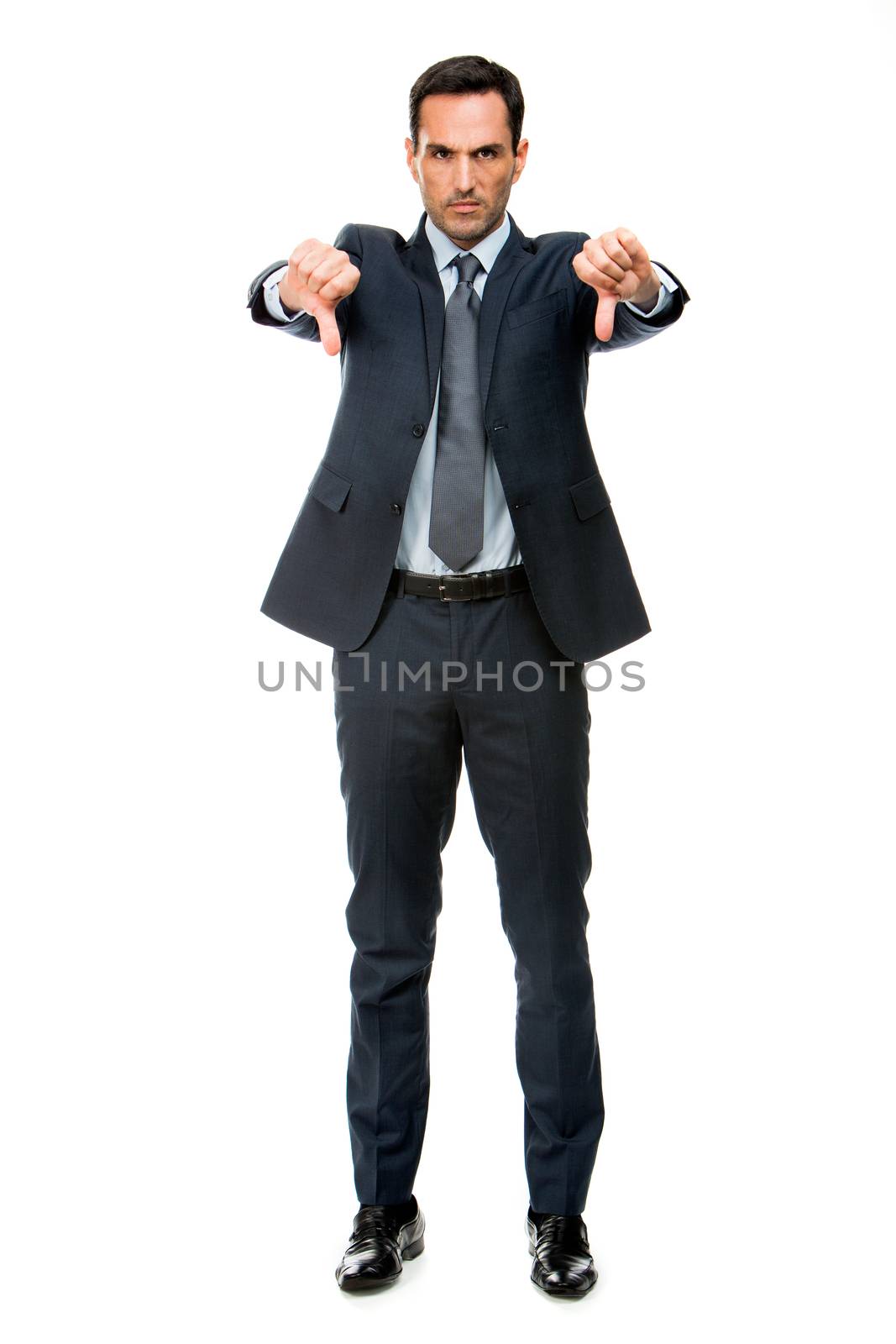 Full length portrait of a businessman looking angry and doing ko sign with both hands