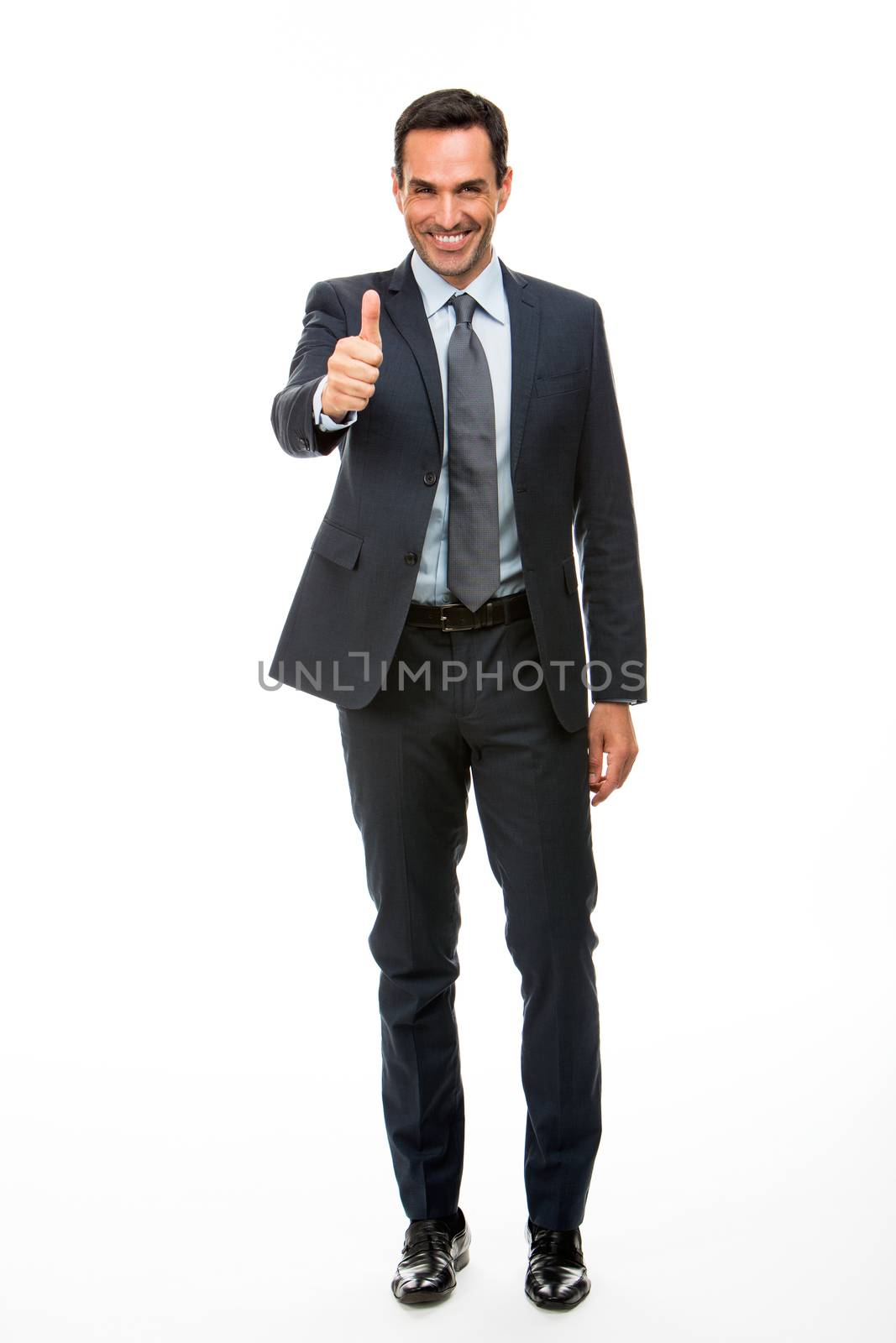 Full length portrait of a businessman smiling and giving ok with one hand