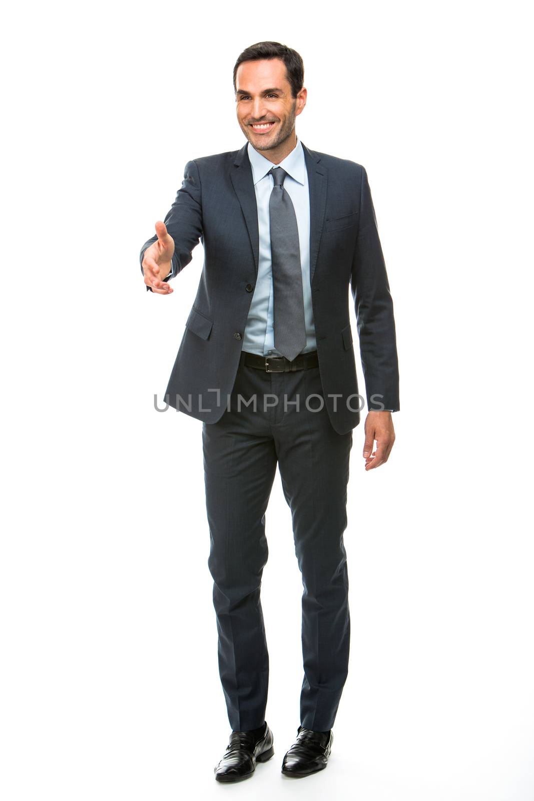 businessman shaking hand by Flareimage