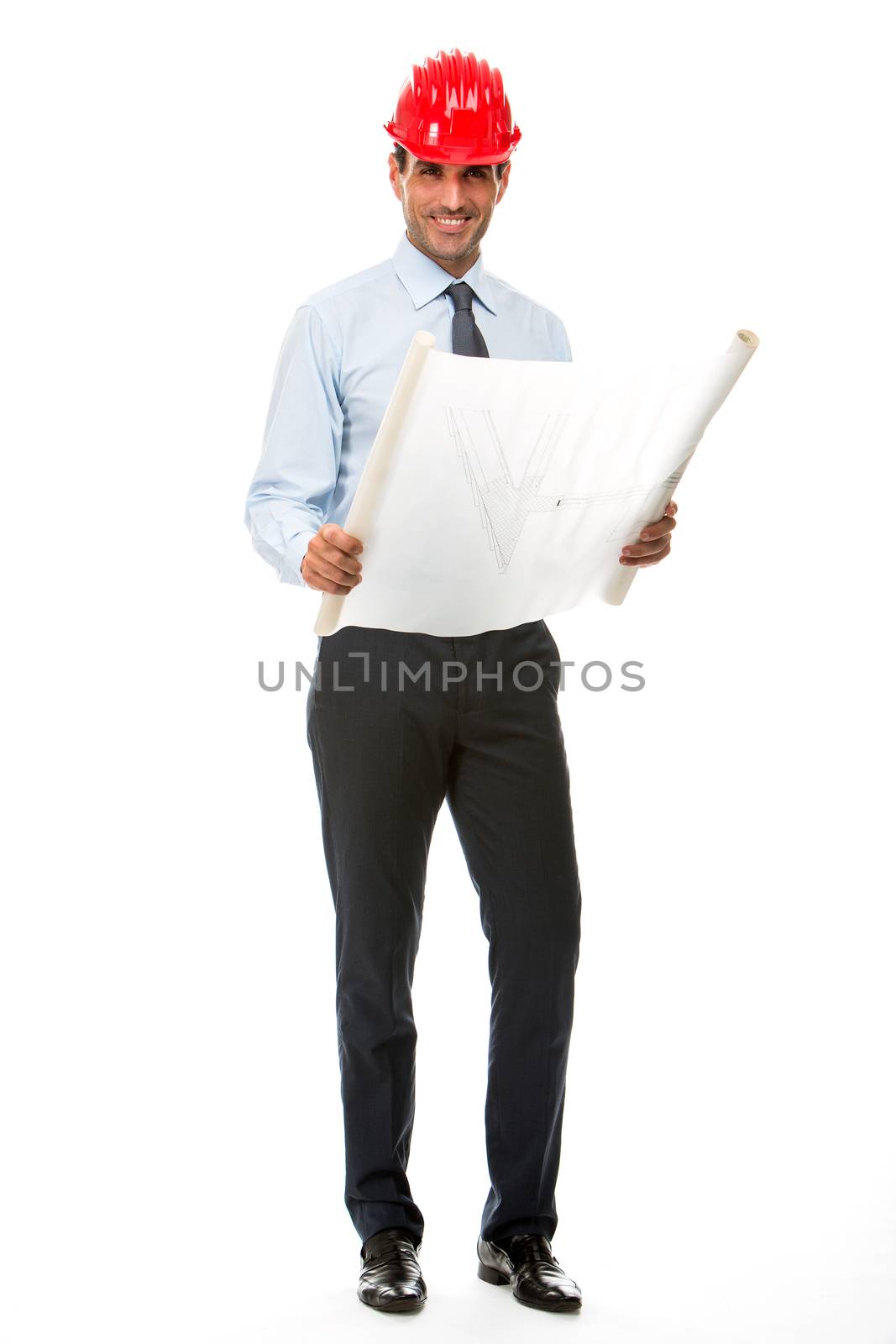 Full length portrait of smiling construction supervisor looking at blueprints