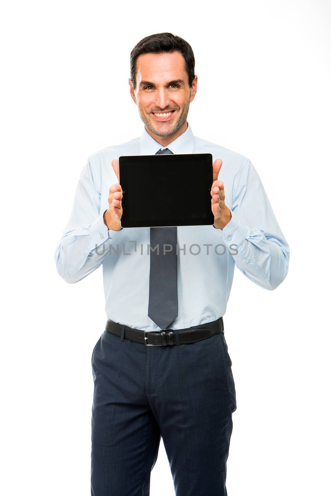 Half length portrait of a smiling businessman with digital tablet