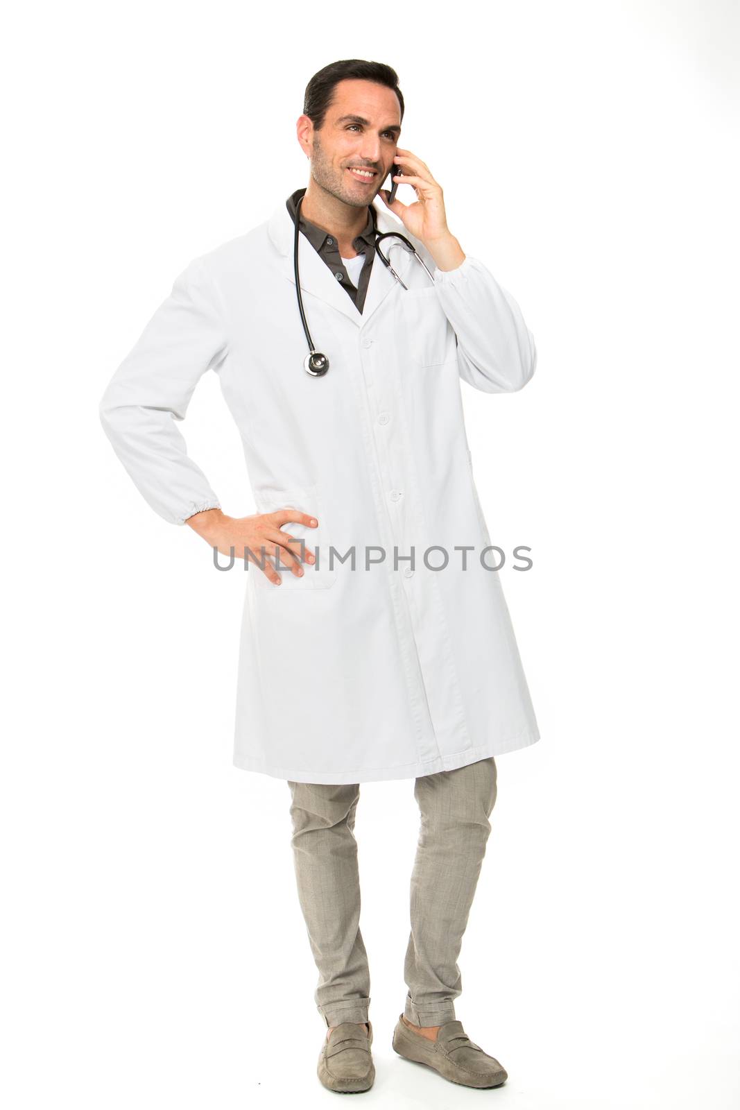 male doctor with stethoscope on the phone by Flareimage