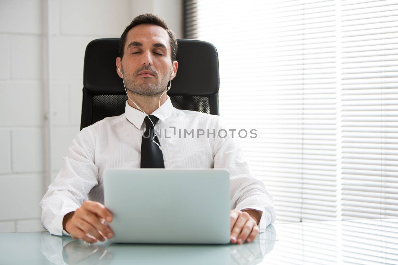 businessman with laptop by Flareimage
