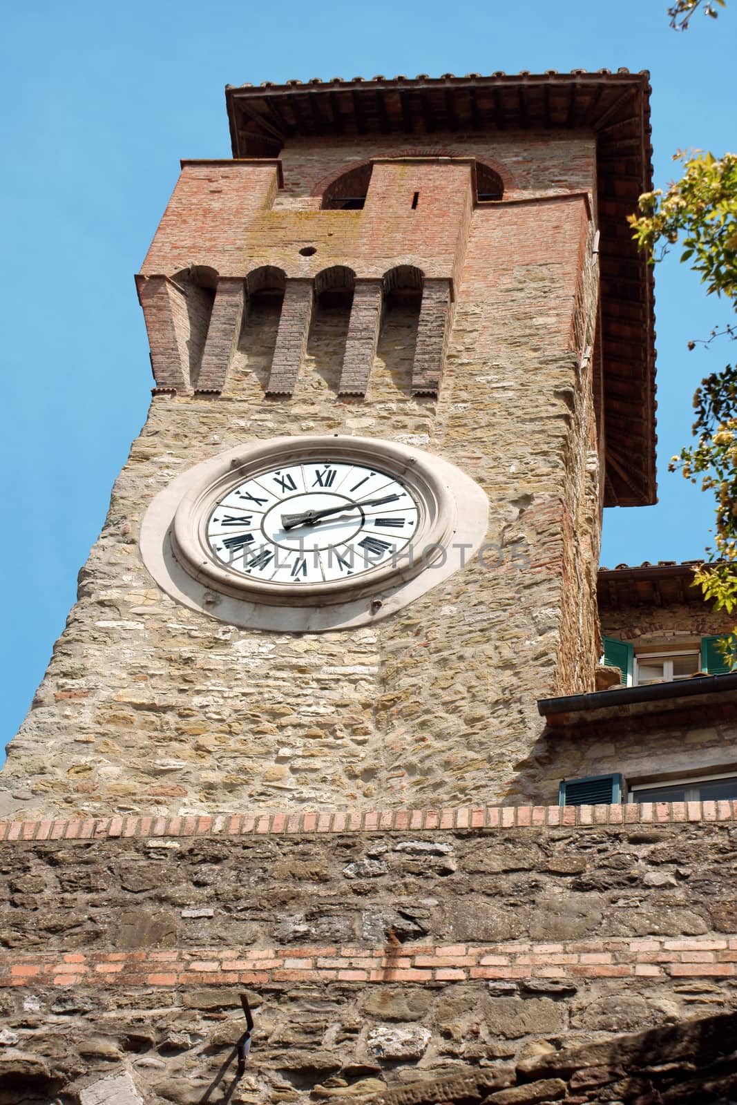 Clock tower in Passignano sul Trasimeno, small town on the homonym lake in the italian region of Umbria.