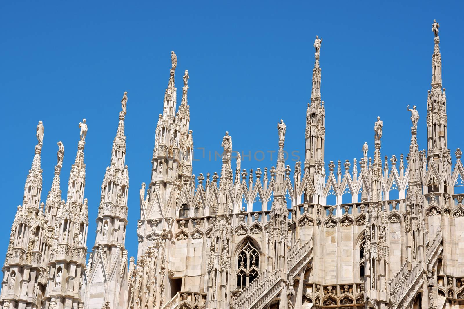 Gothic architecture of Milan Cathedral in Piazza del Duomo. It is the fourth largest church in the world. The construction started in 1386 and took about five centuries.