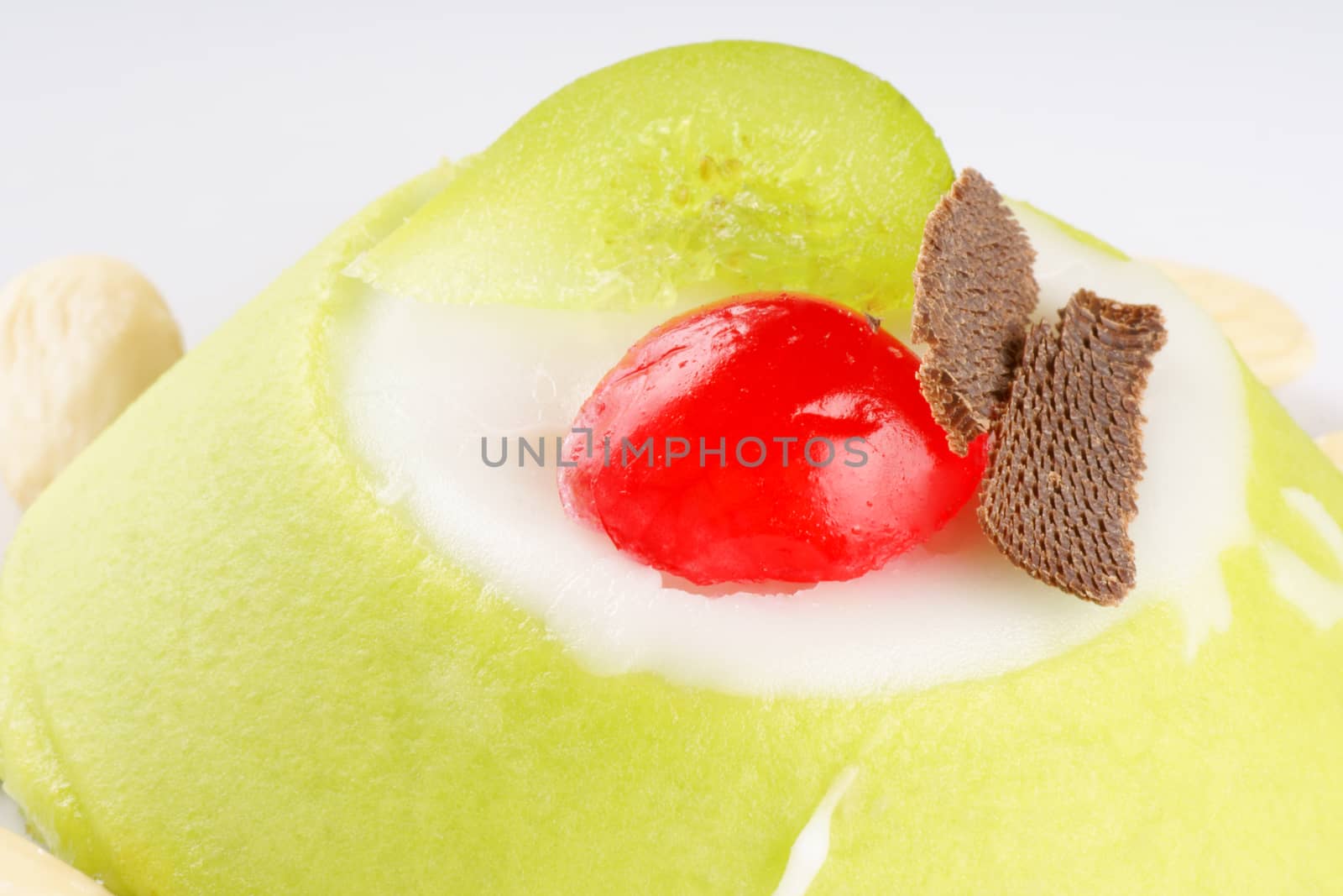 Close-up of a mini sicilian cassata with pieces of candied fruit and chocolate