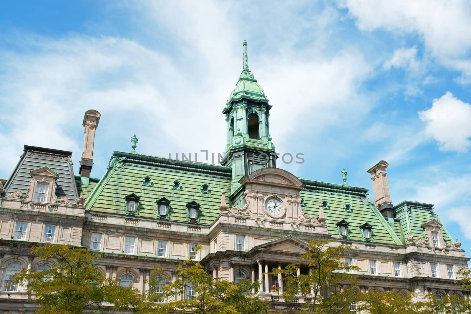 The old Montreal city hall (hotel de ville) on a cloudy day