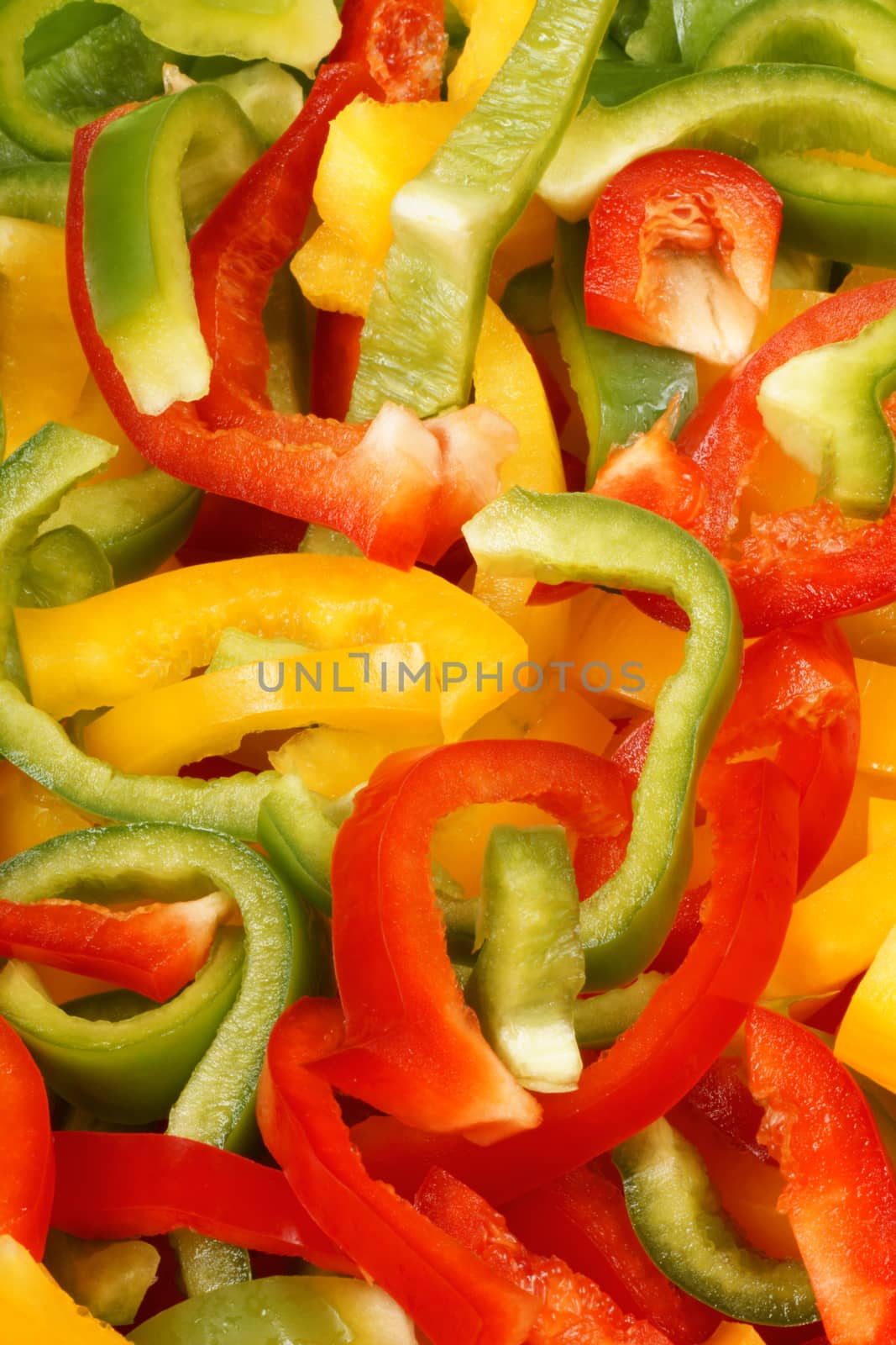 Organic background made of green, yellow and red bell peppers