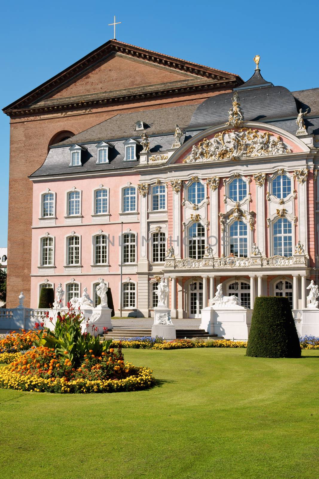 South wing of Prince-electors Palace in Trier, Germany. It was built in rococo style from 1756 by architect Johannes Seiz and the sculptor Ferdinand Tietz. In the background Constantine Basilica.
