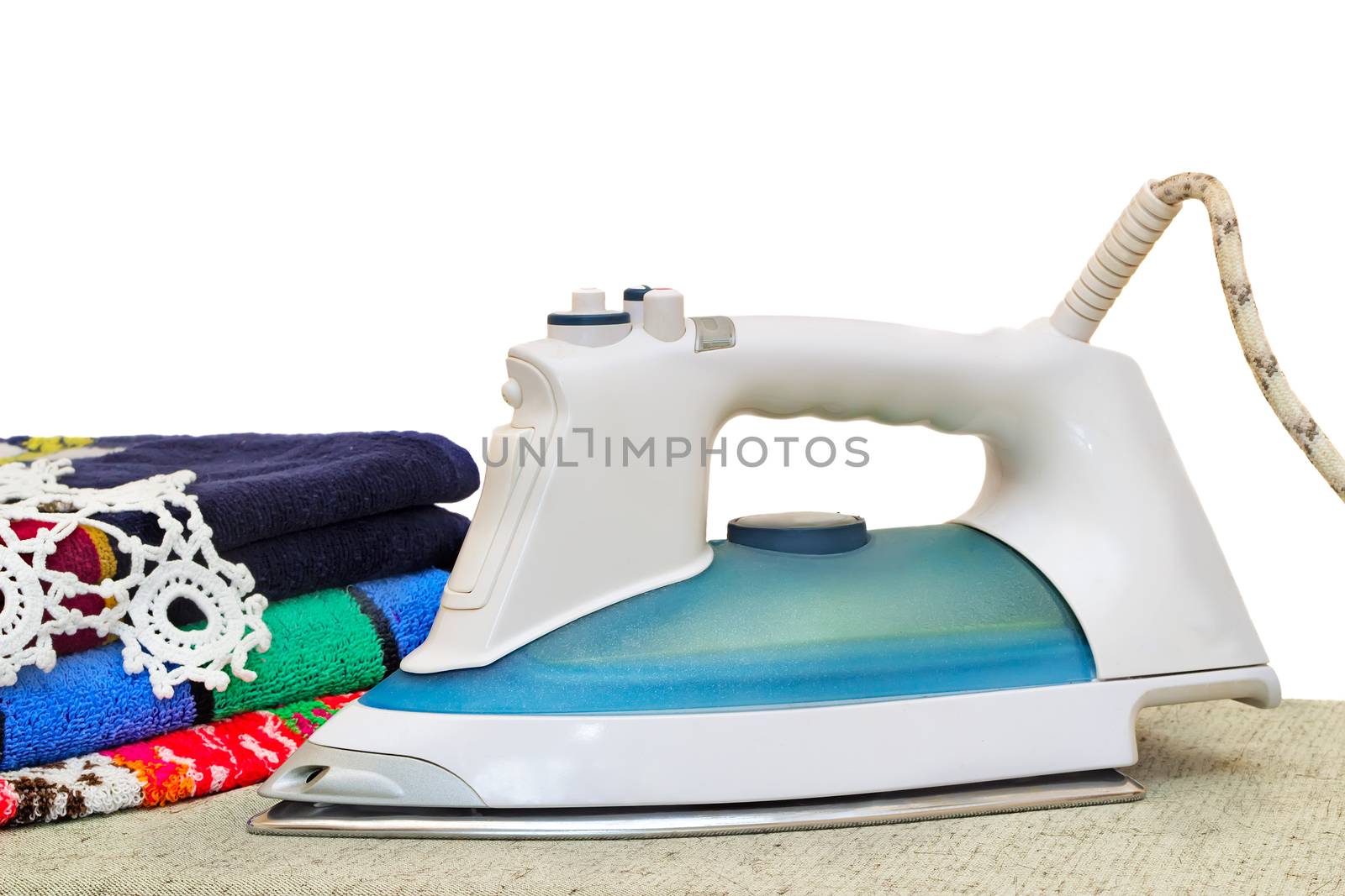Convenient electric iron on the Ironing Board. Presented on a white background.