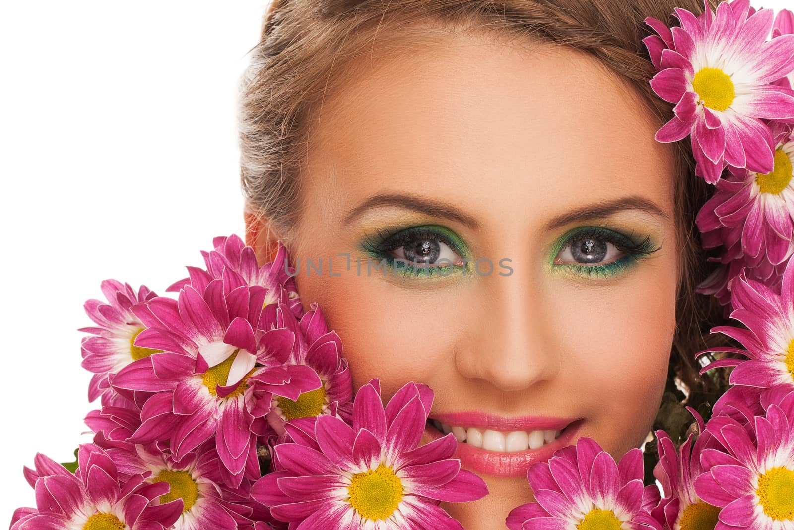 Beautiful young caucasian woman with flowers in hairover white background
