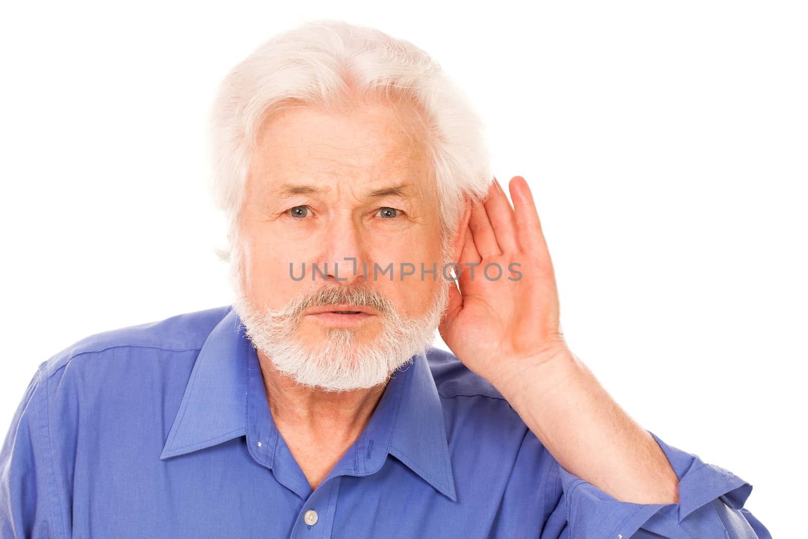 Handsome elderly man holds hand on ear isolated over white background