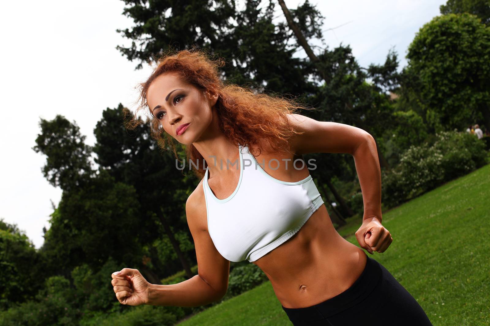 Beautiful middleaged woman working out by rufatjumali