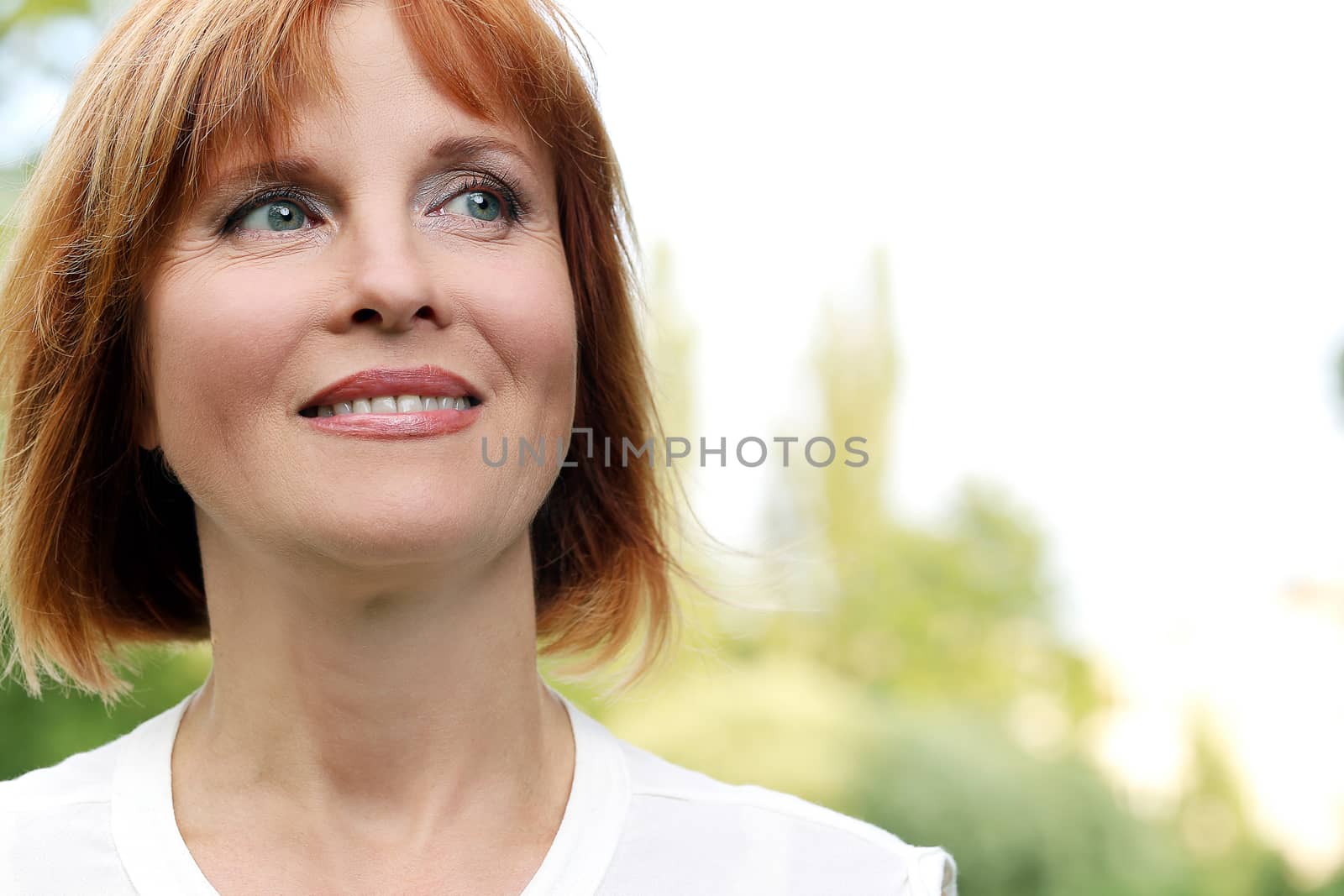 Portrait of an attractive woman who is relaxing at a park