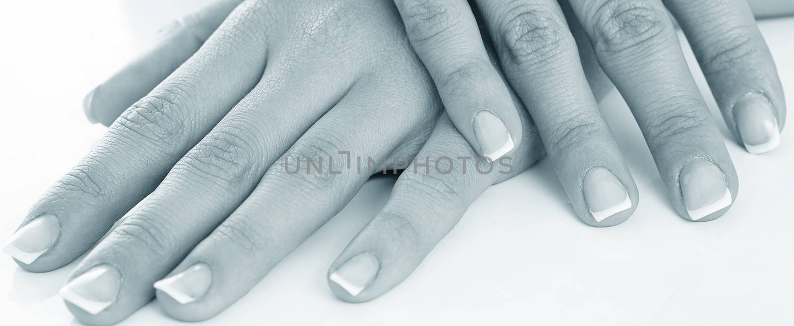 Young woman hands with french manicure by rufatjumali