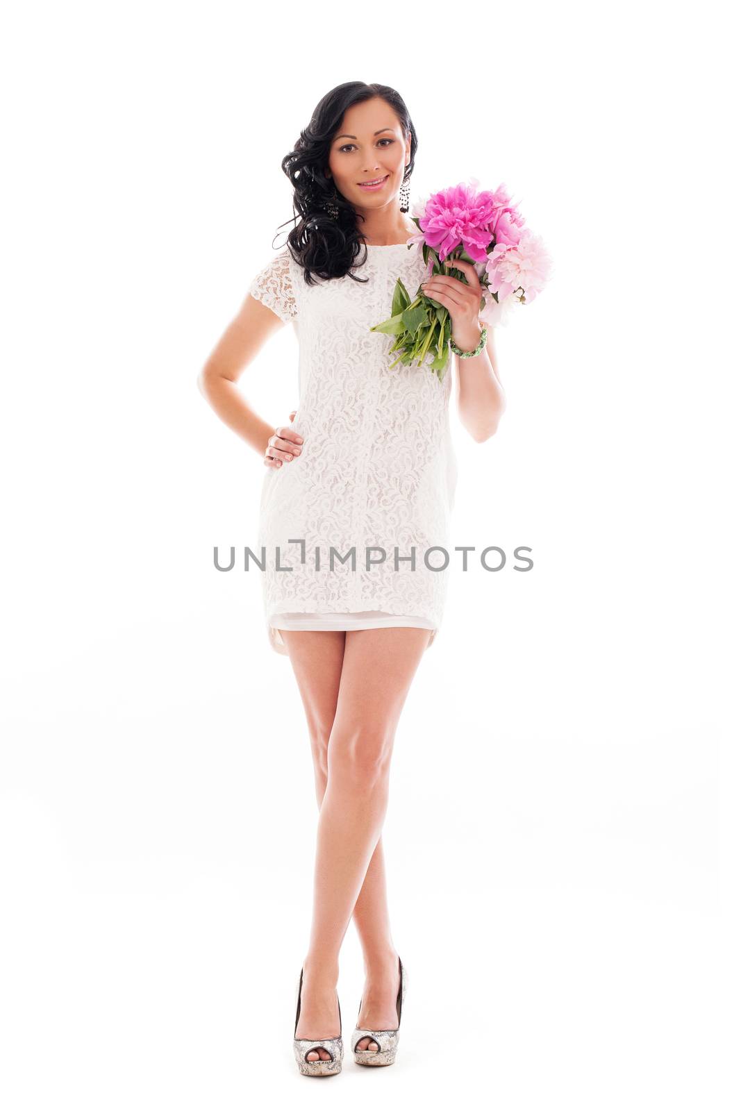 Beautiful woman in white with bouquet of peonies isolated over white background