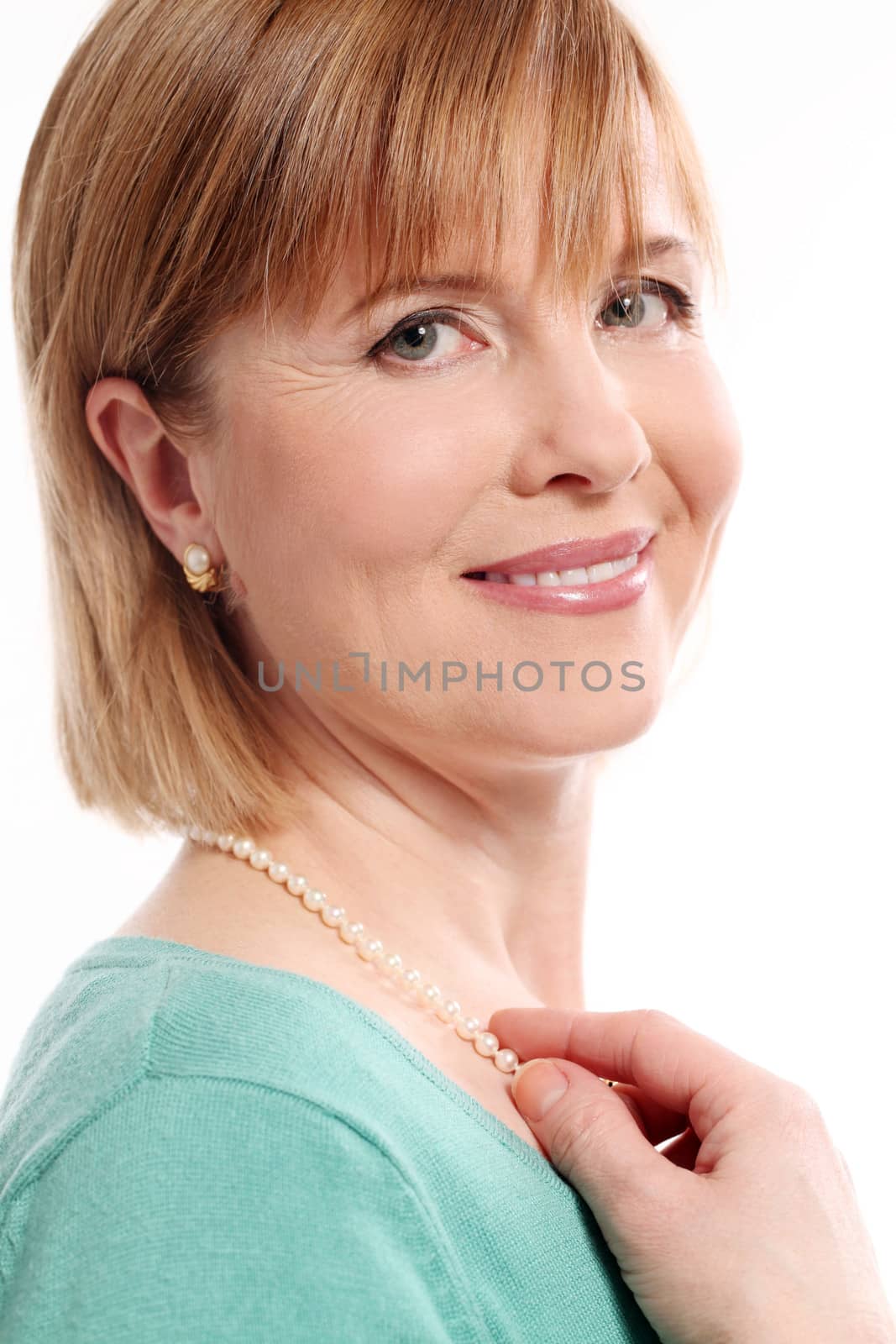 Beautiful middleaged woman with short hair on a white background