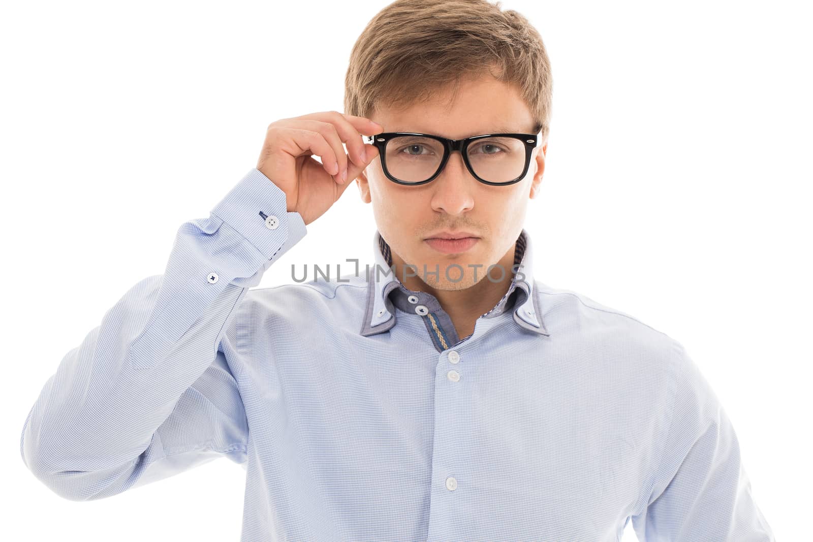 Handsome man in a blue shirt and glasses over a white background