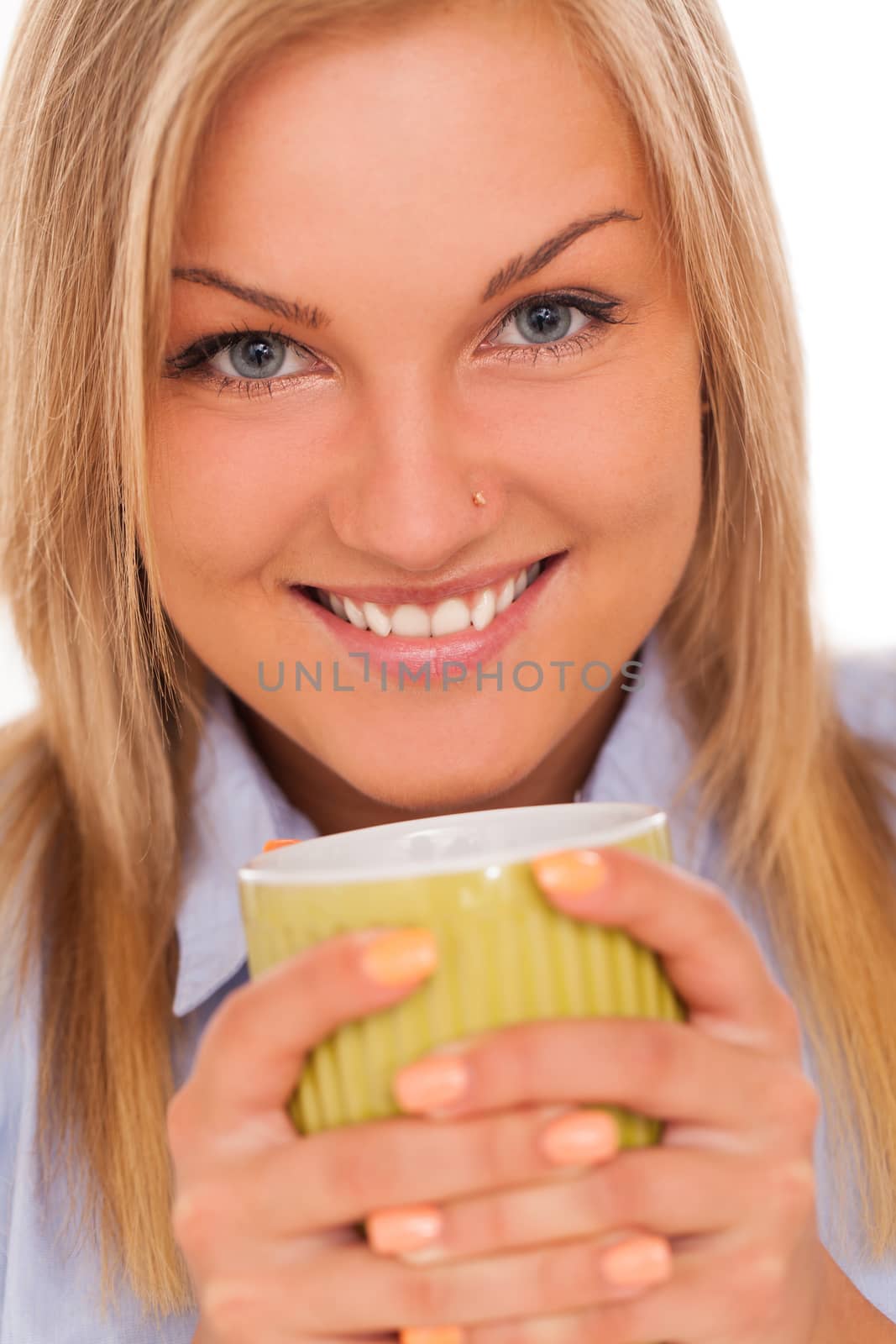 Closeup portrait of young blond caucasian woman smiling with mug