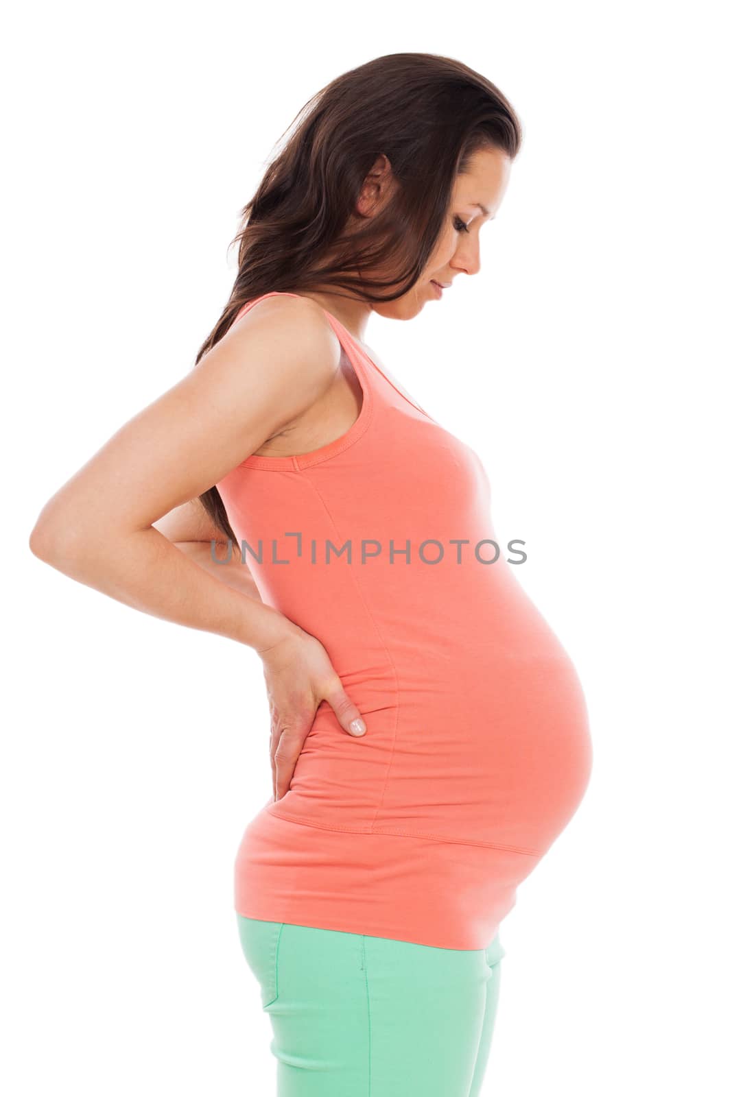 Beautiful pregnant woman isolated over white background