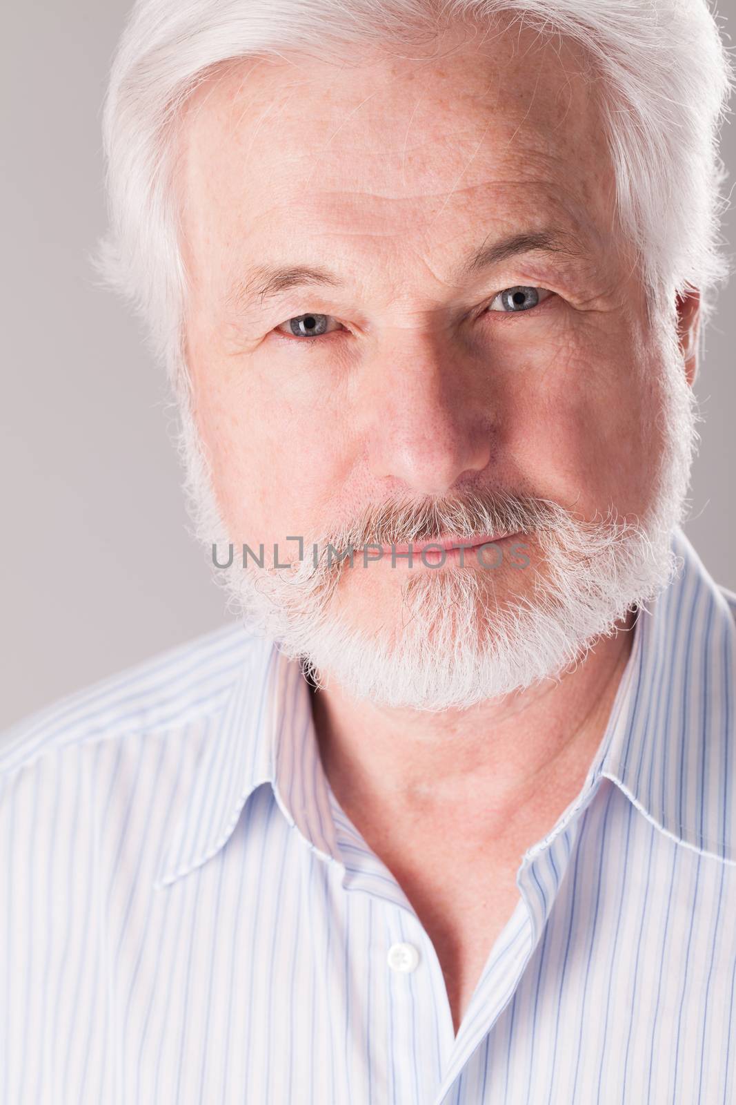 Handsome, elderly man with white beard
