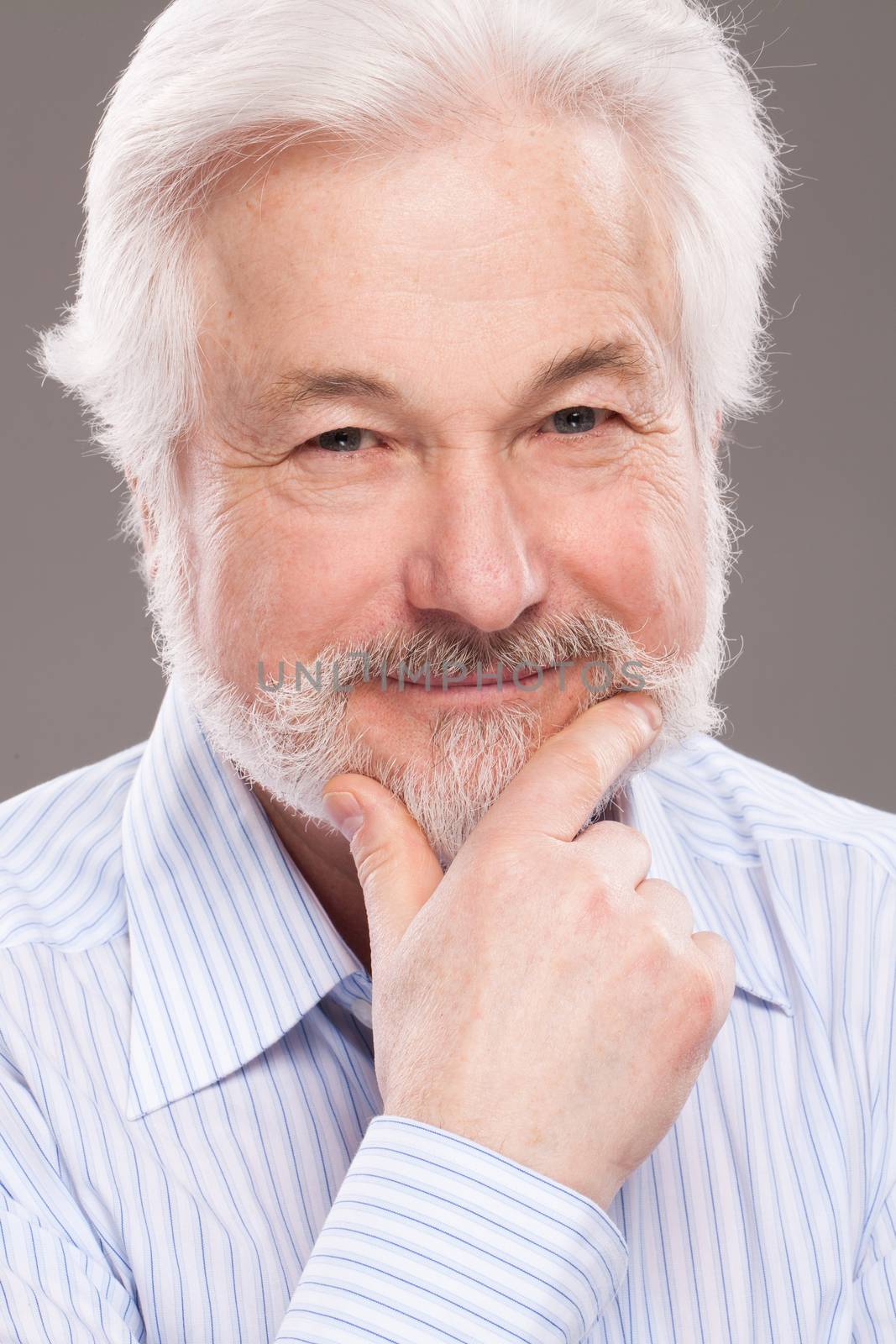 Handsome, elderly man with white beard