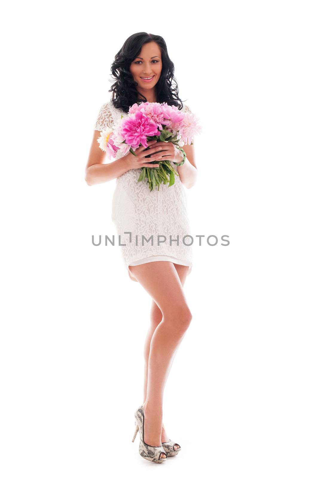 Beautiful woman in white with bouquet of peonies isolated over white background