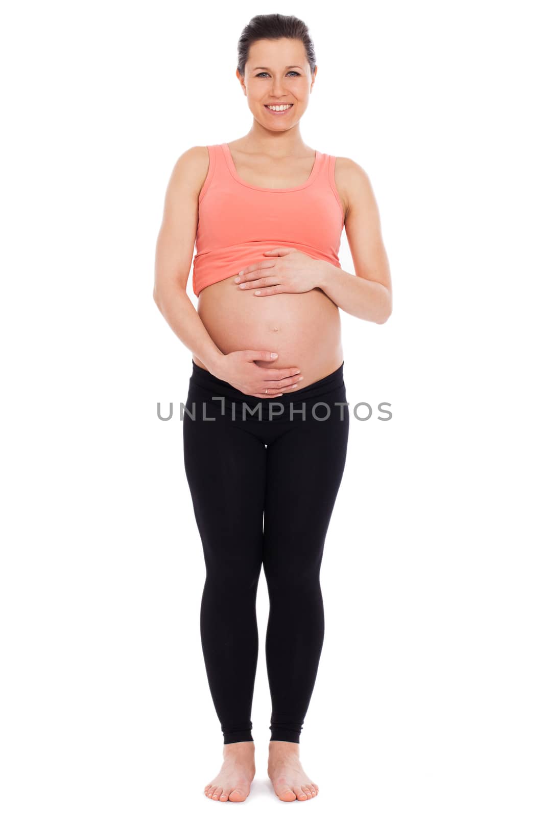 Beautiful pregnant woman isolated over white background