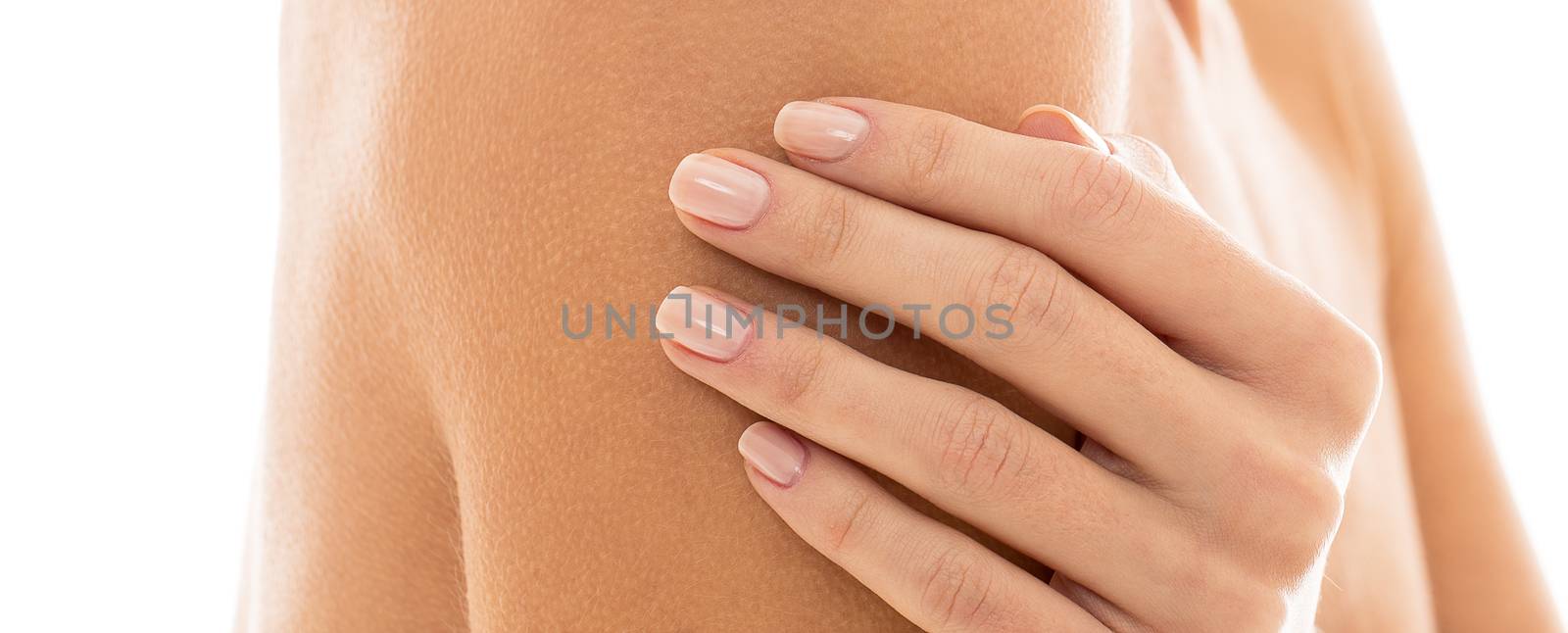 Closeup picture of a woman's hand and shoulder over a white background
