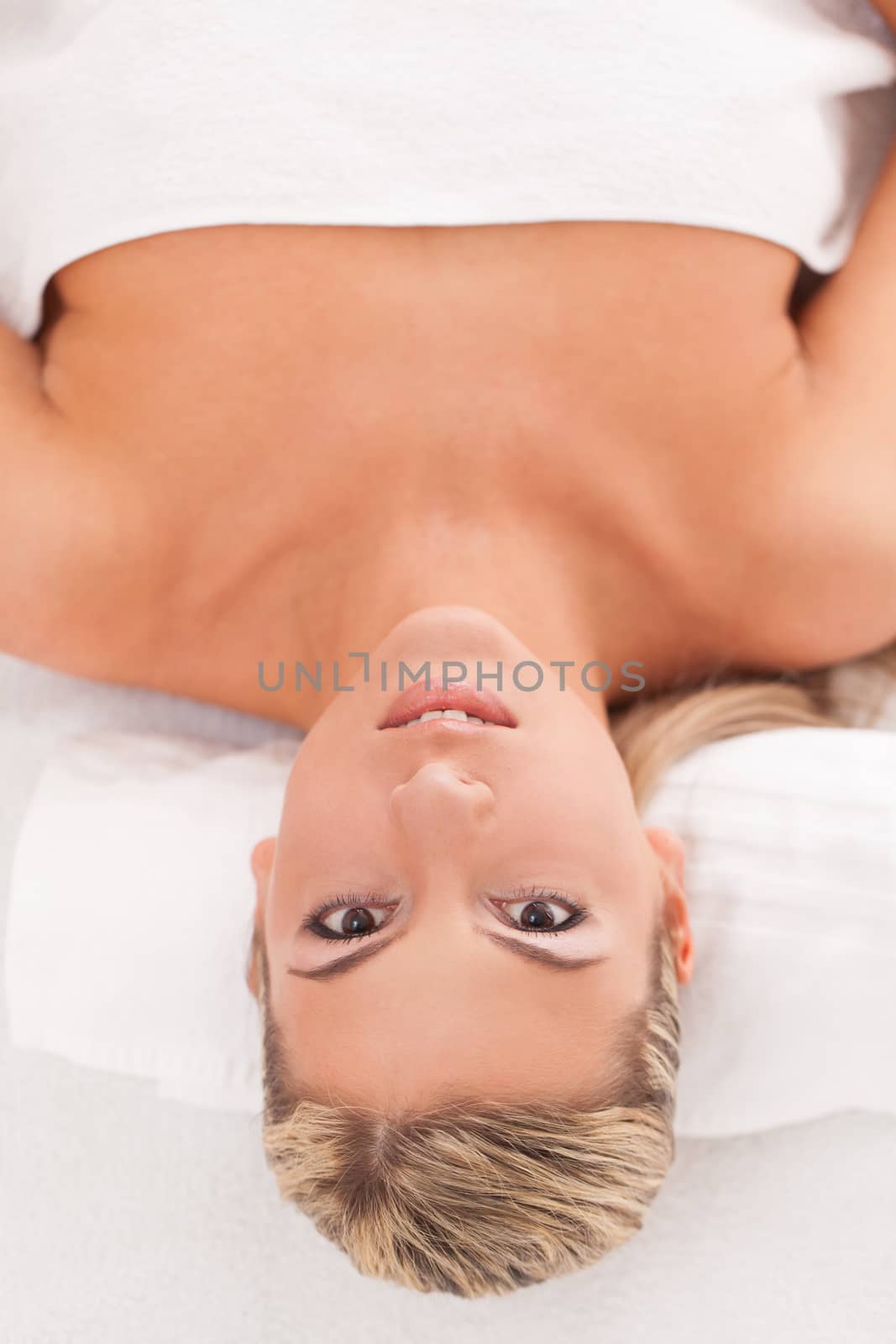 Beautiful woman lying in a spa by rufatjumali