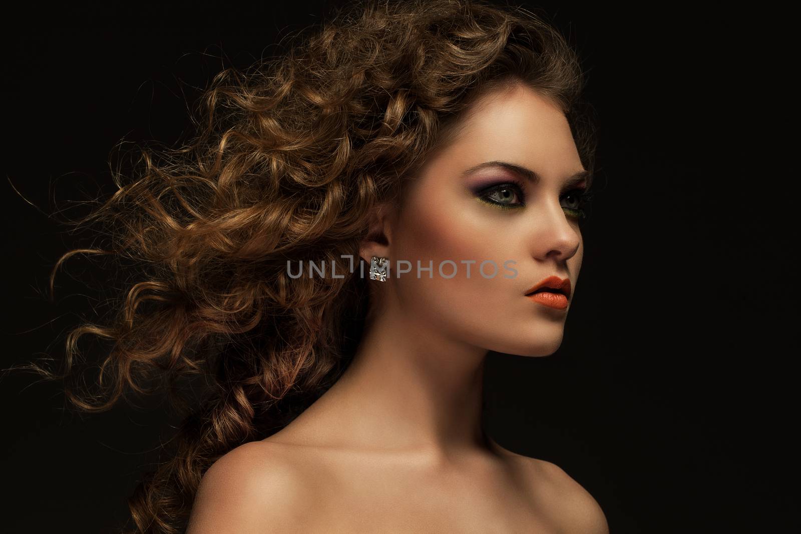 Beautiful woman with curls and makeup by rufatjumali
