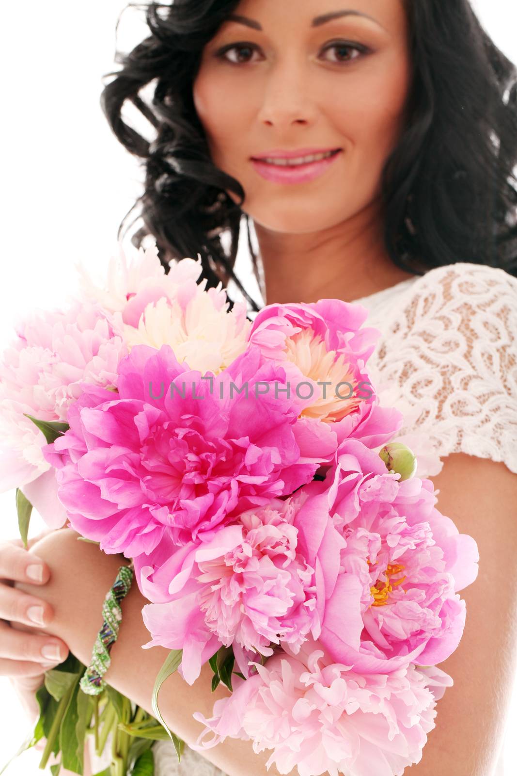 Beautiful caucasian woman with bouquet of peonies