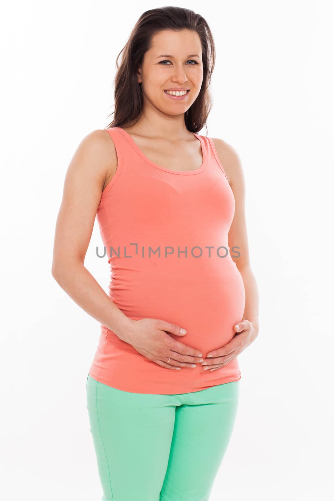 Beautiful pregnant woman isolated over white background