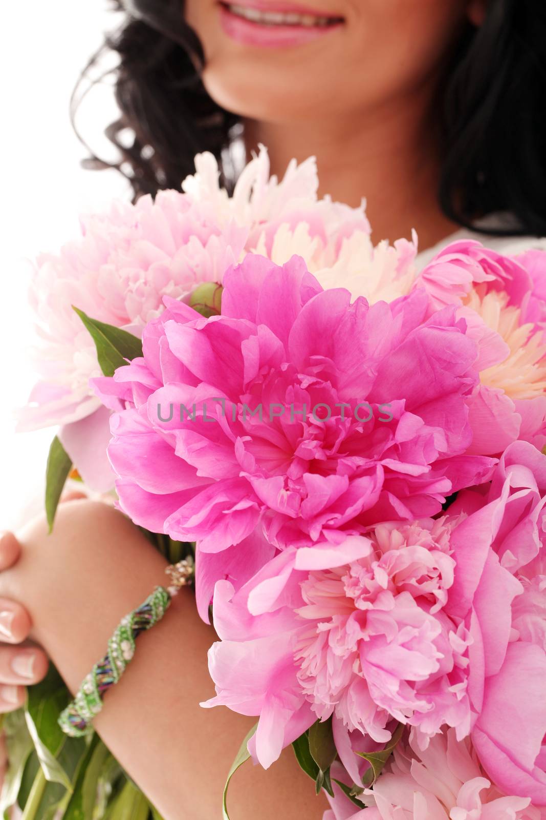 Bouquet of peonies in woman's hands by rufatjumali