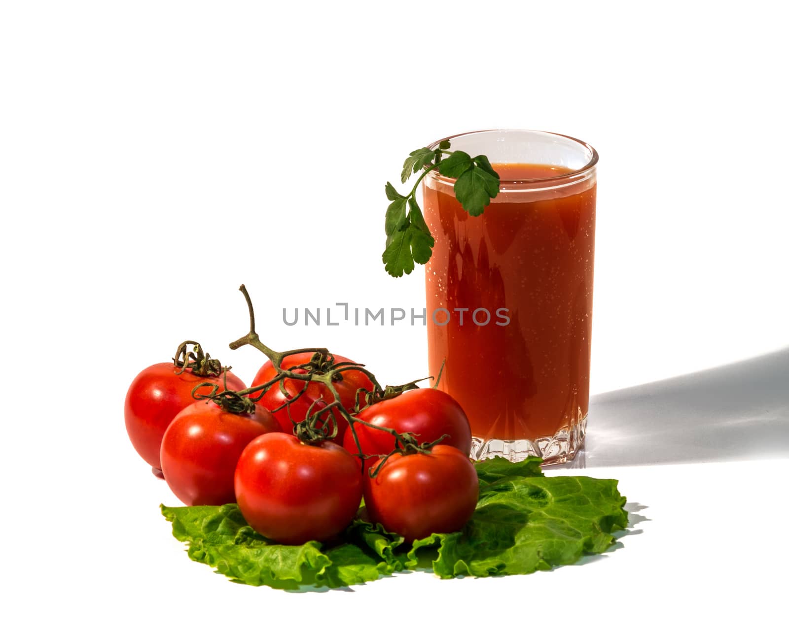 Still life with tomatoes and tomato juice isolated on white background