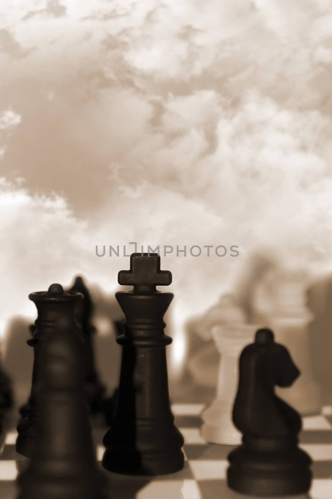 chess pieces isolated against sky by morrbyte