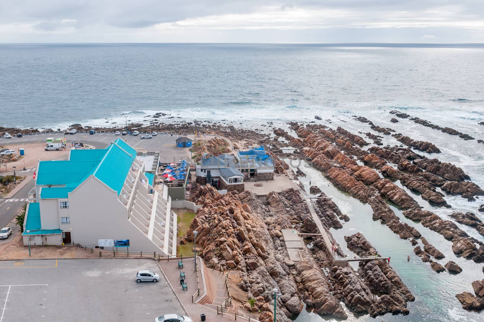 MOSSELBAY, SOUTH AFRICA - DECEMBER 31, 2014: View from the cave at Cape St. Blaize towards the hotel and swimming pool at The Point