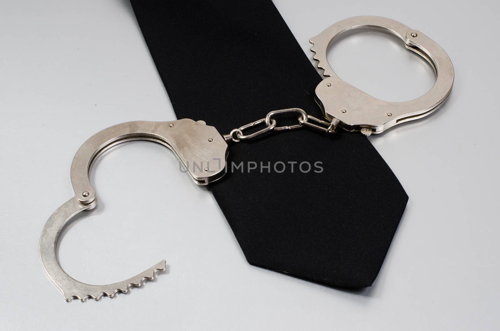 black tie and handcuffs by sarkao
