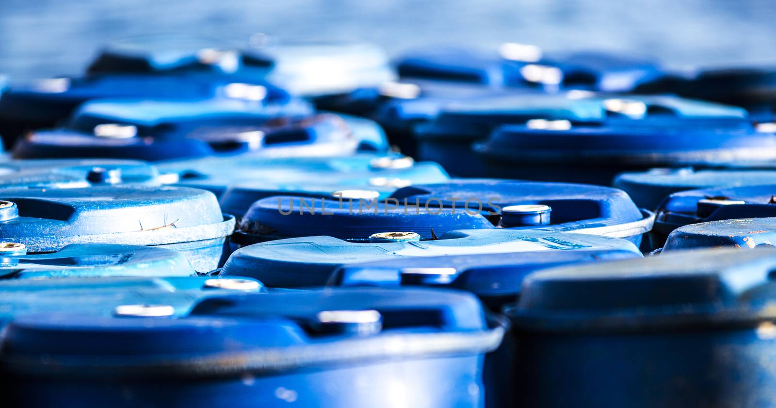 Collection of used blue barrels