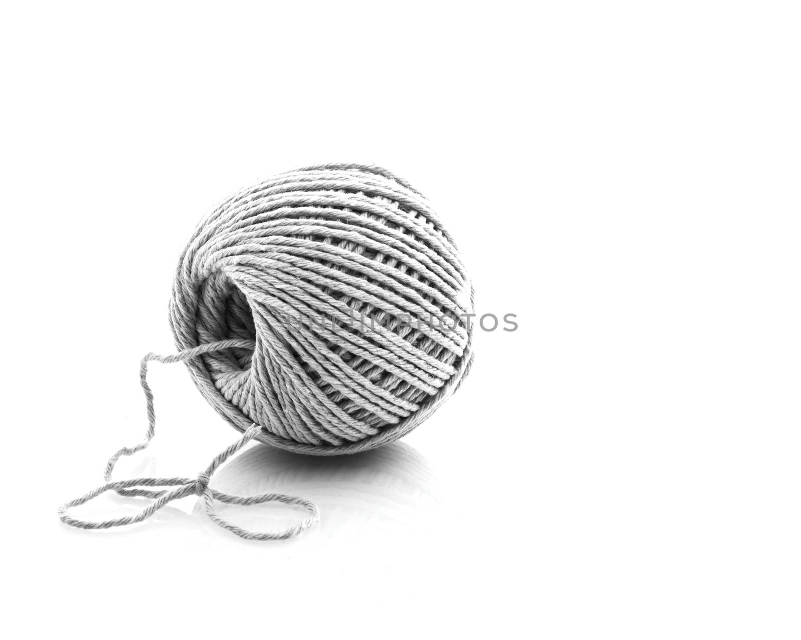 Macro Shot Of A Ball Of String With A Bow Tied At One End and Copy Space for Text