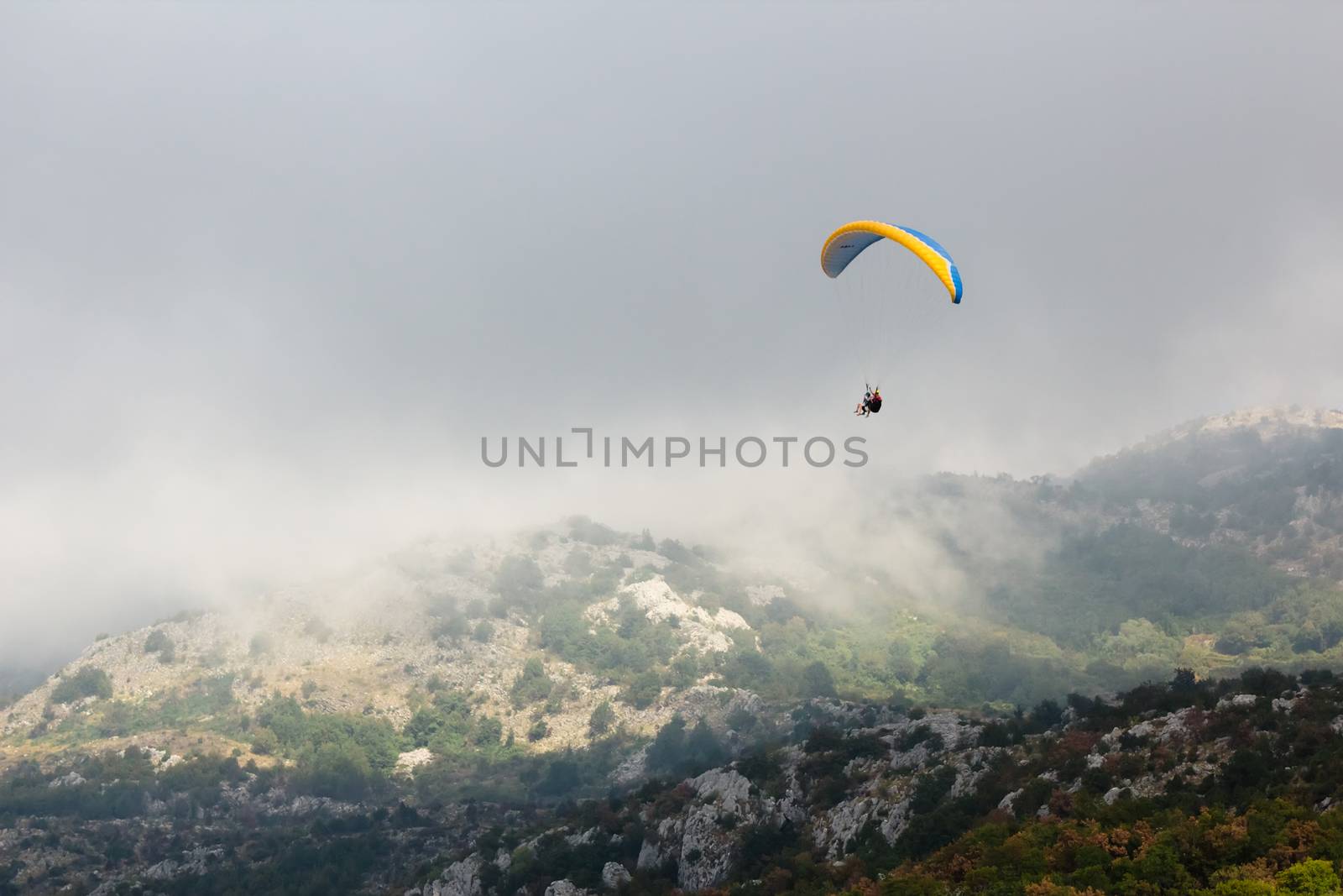 The Paraglide silhouette over mountain peaks. Montenegro