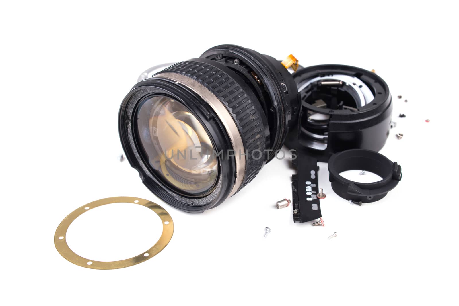 camera lens has been dropped and shattered on white background