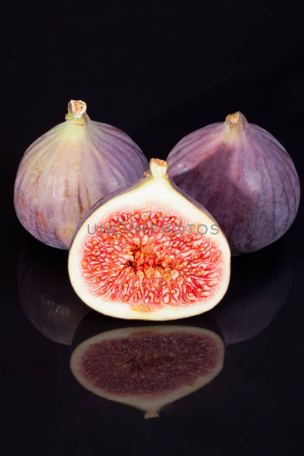 fruits of fresh figs isolated on black  background
